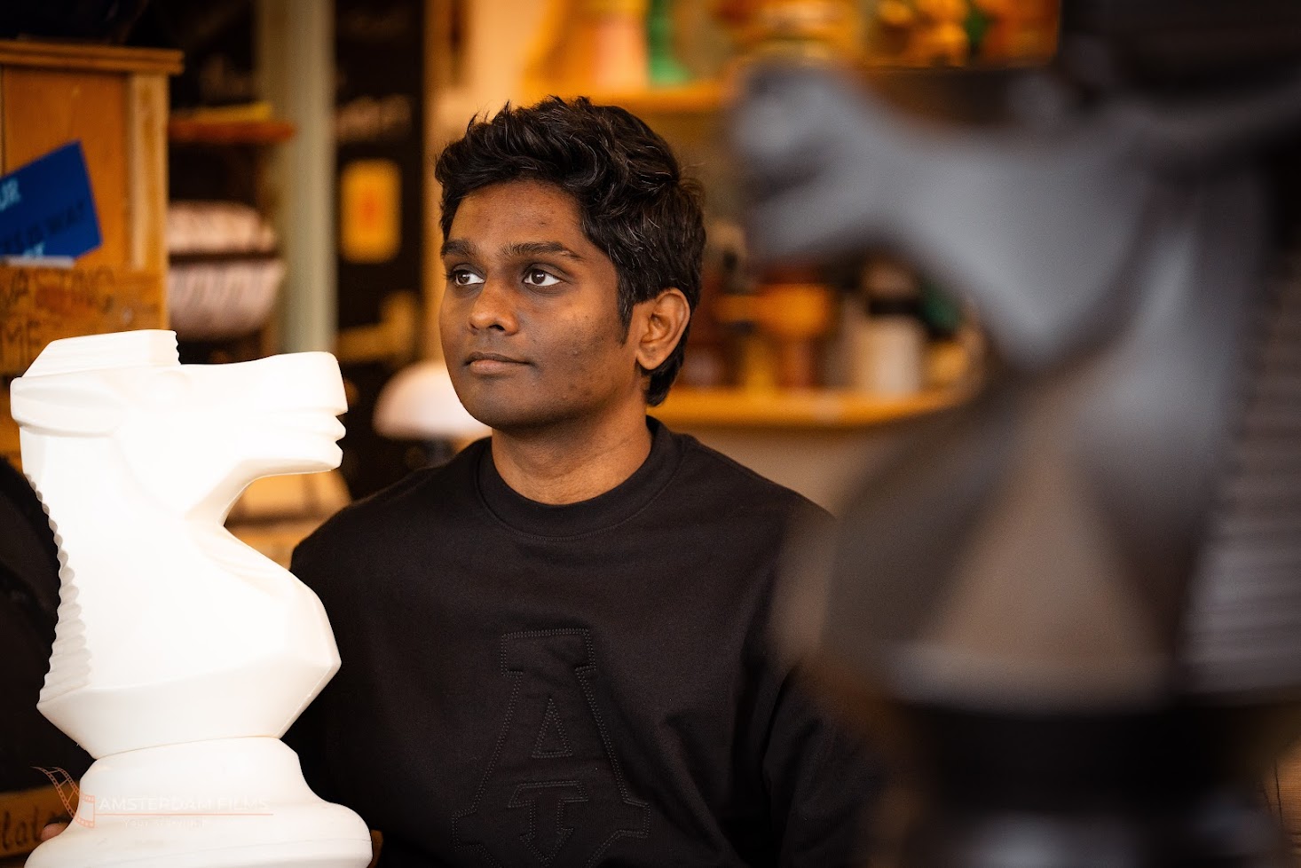 Arun Manukonda portrait with chess pieces