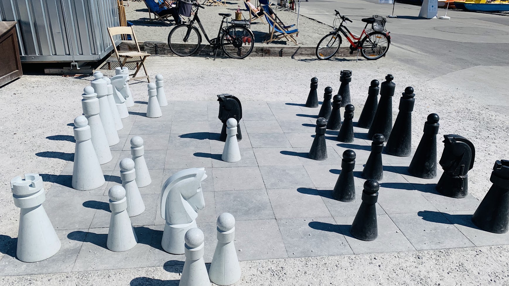 Giant chessboard with life-size chess pieces